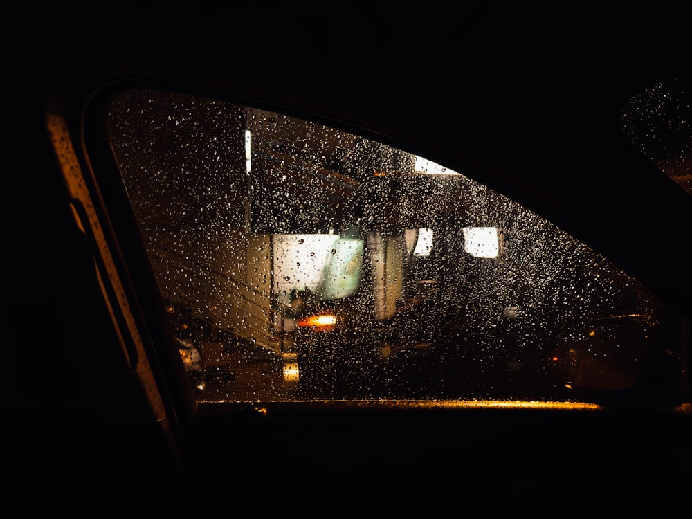 a car window with rain drops on it