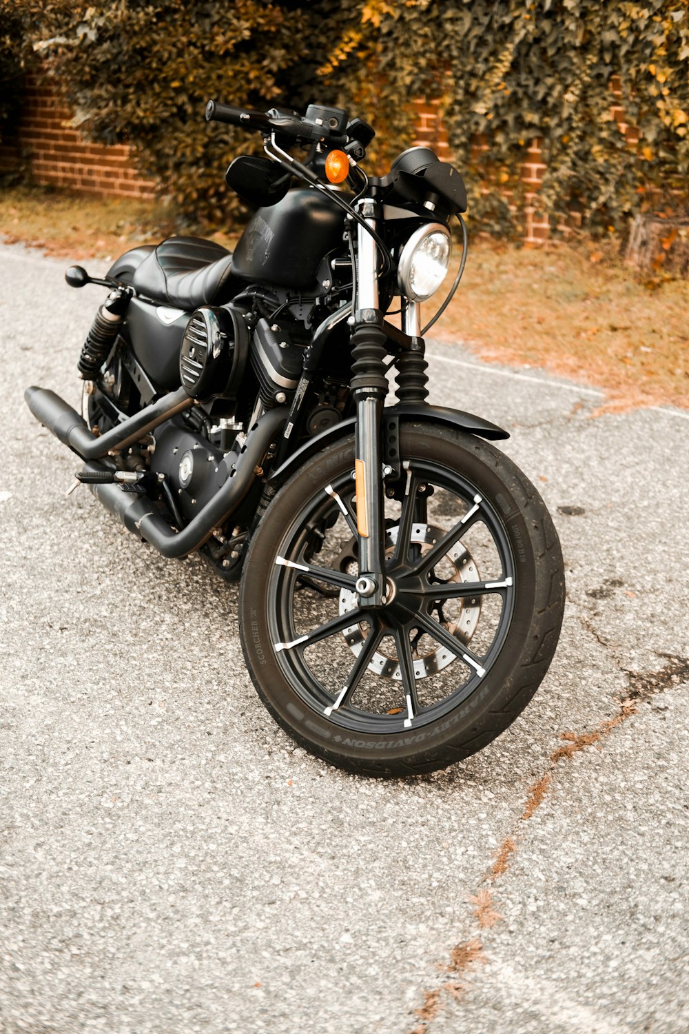 a black motorcycle parked on the side of the road