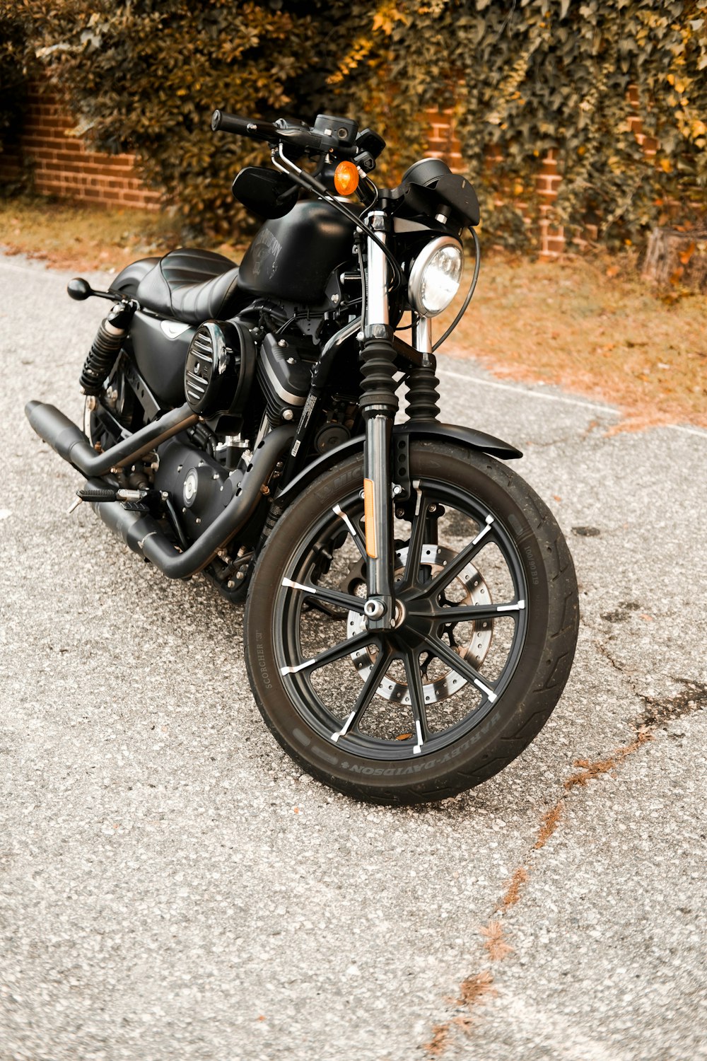 a black motorcycle parked on the side of the road