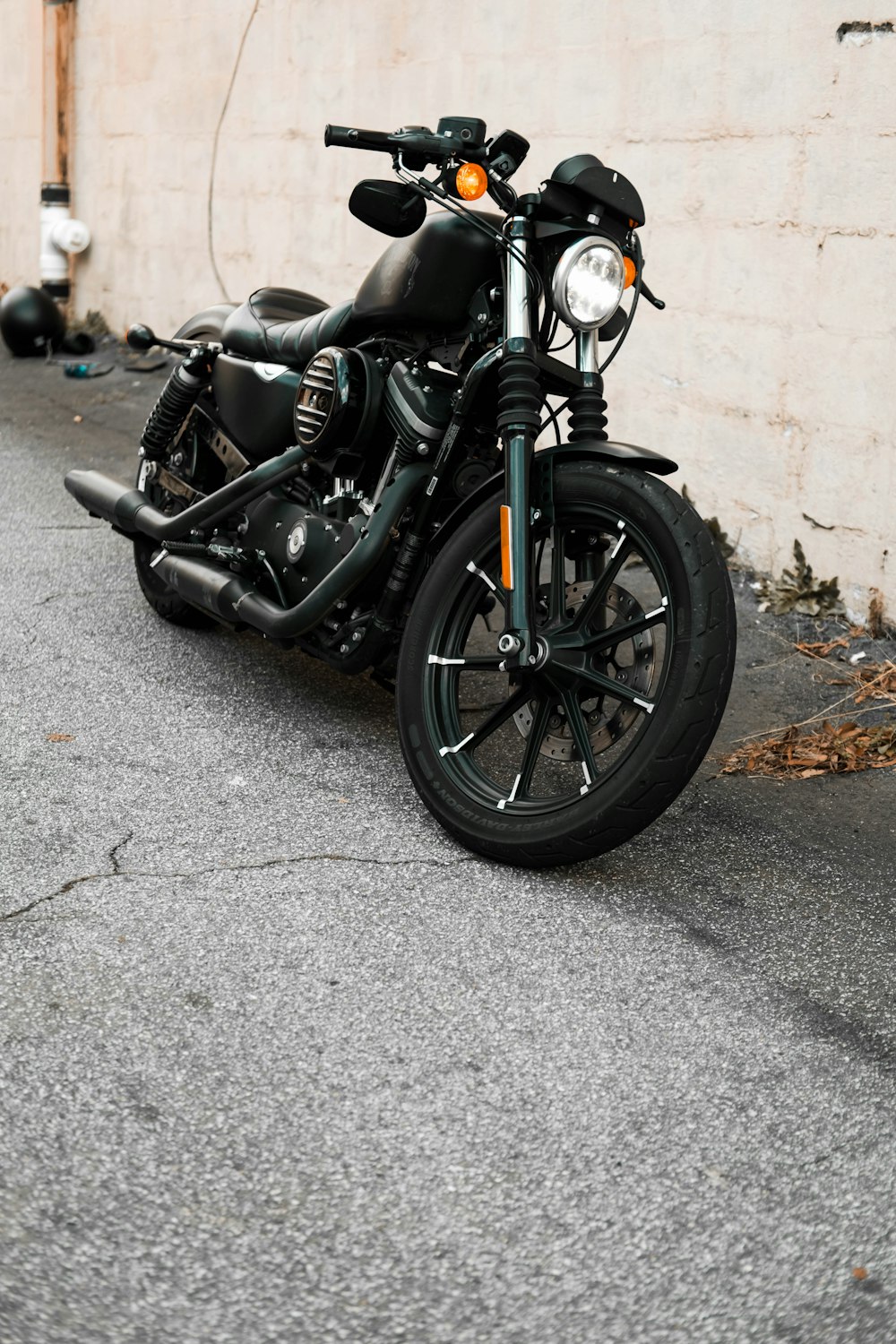 a black motorcycle parked in front of a building