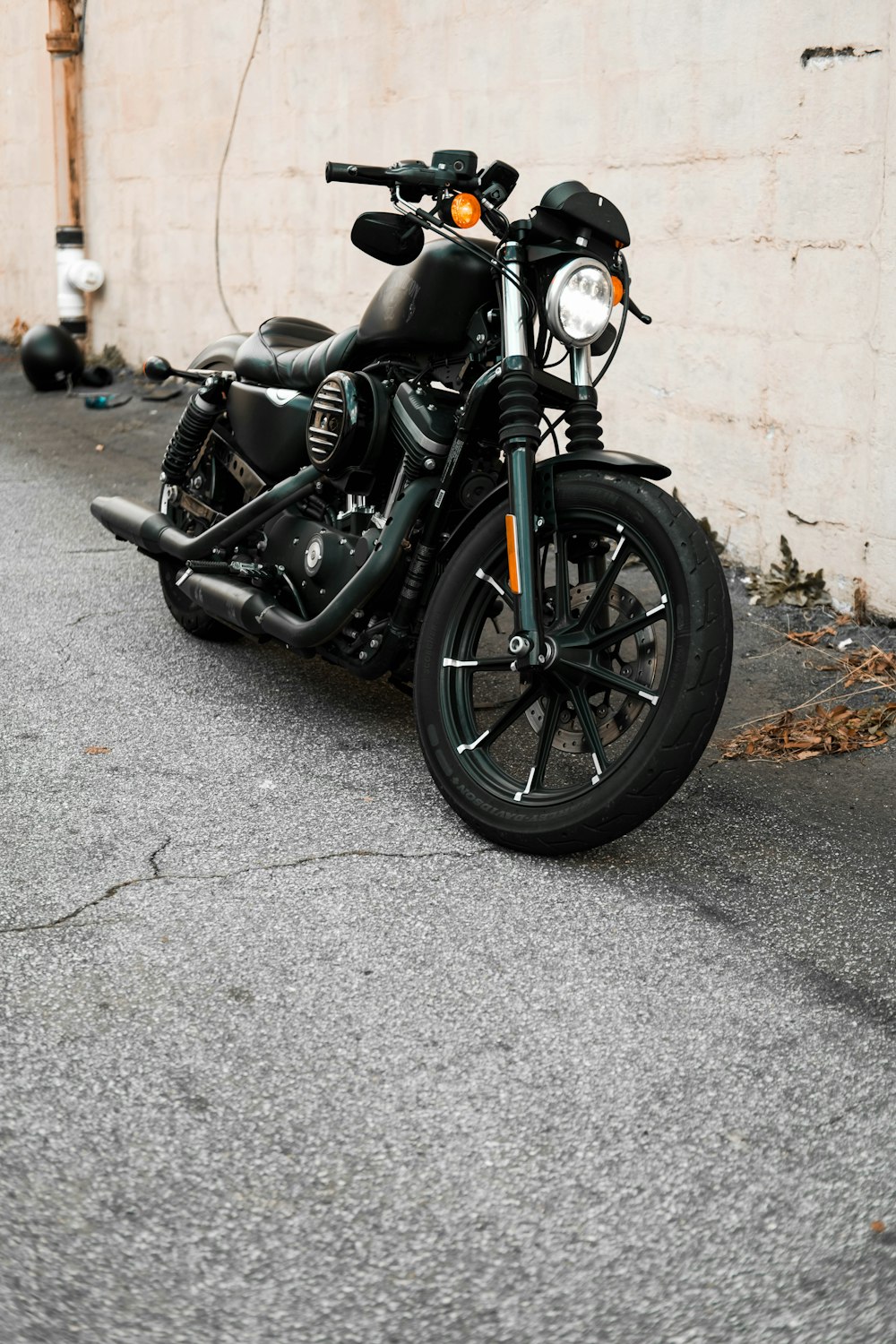 a black motorcycle parked in front of a building