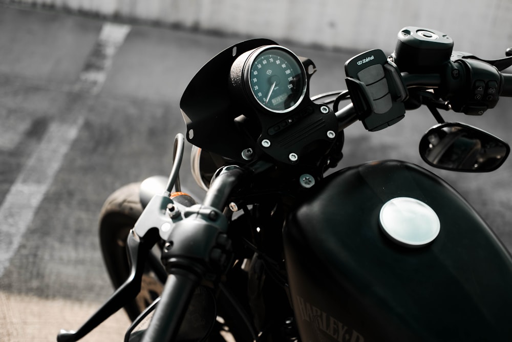 a close up of a motorcycle with a speedometer