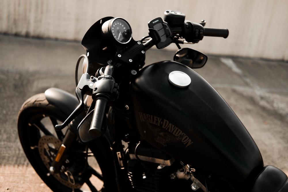 a black motorcycle parked on the side of the road