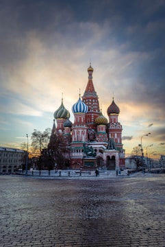 a large red building with a blue and white dome