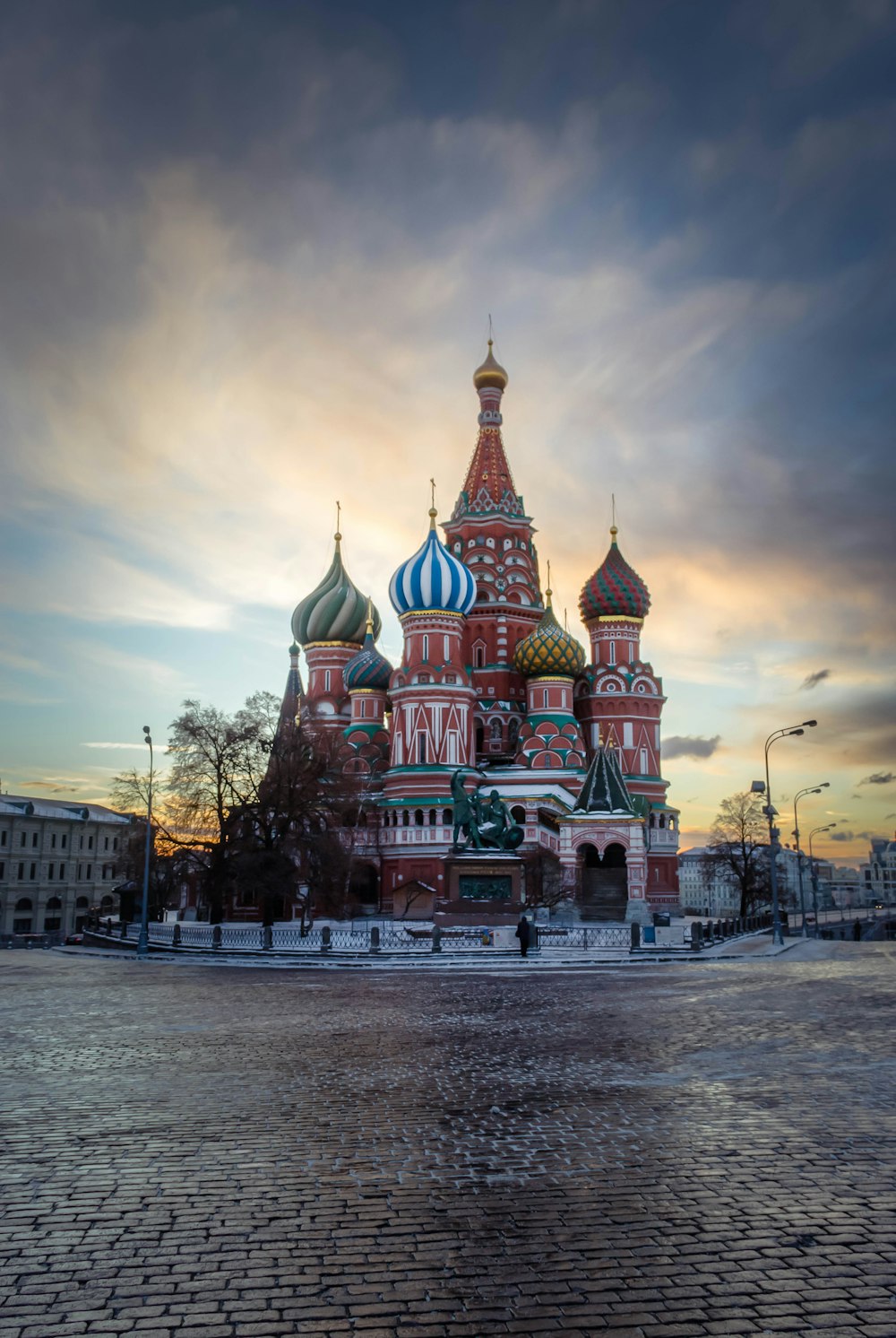 a large red building with a blue and white dome