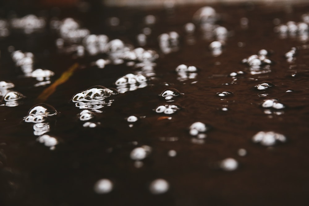 a close up of water droplets on a table