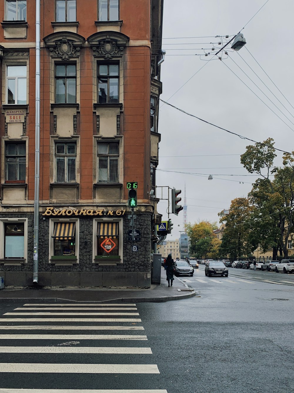 a tall building sitting on the side of a road