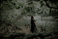 A serene outdoor scene where a woman breathes deeply, embracing calm.