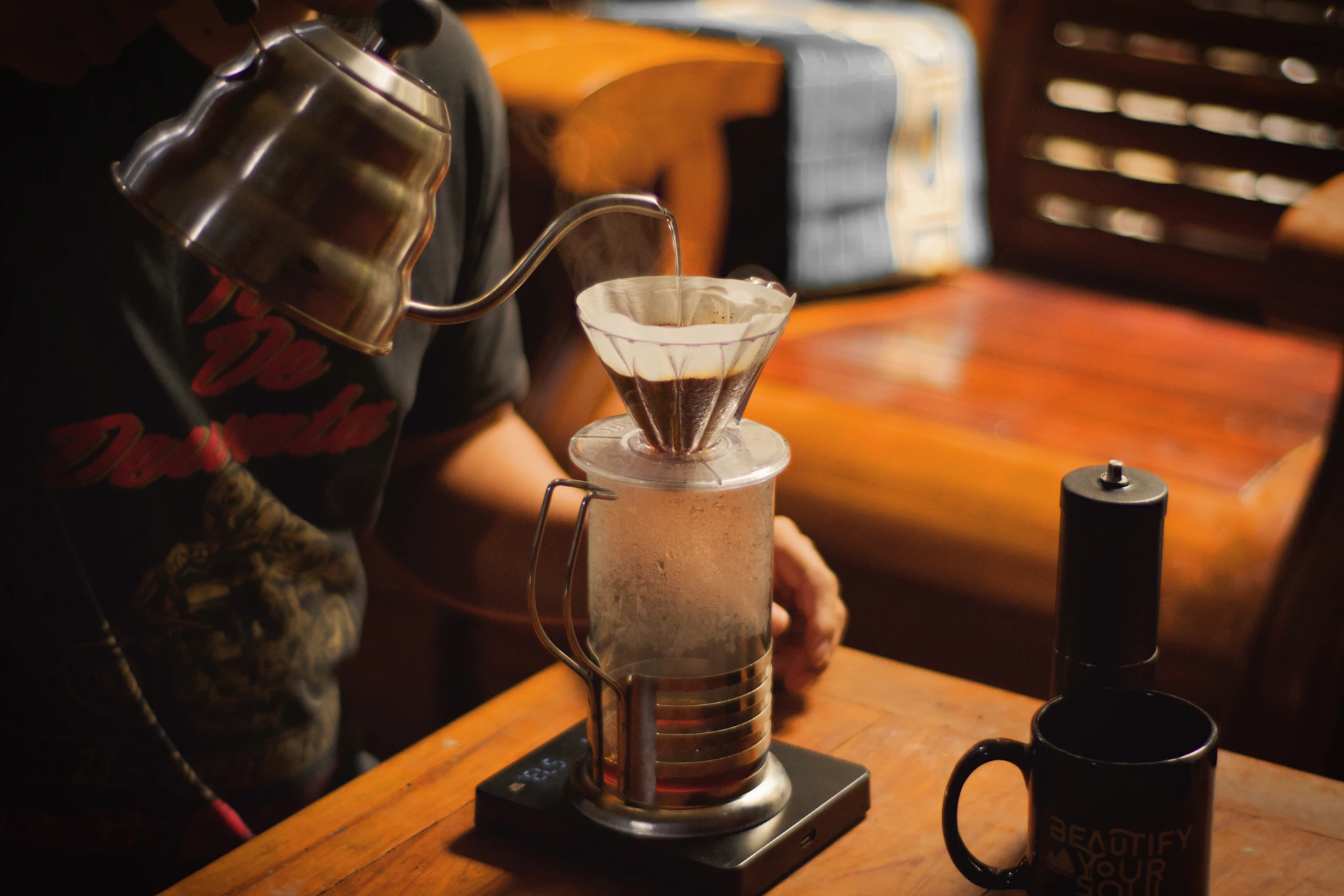 a coffee maker sitting on top of a wooden table
