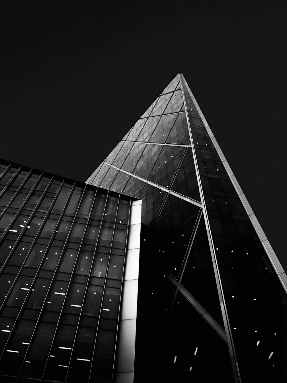 a black and white photo of a very tall building