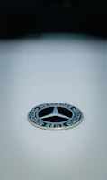 Mercedes collectible card with elegant design and metallic accents.