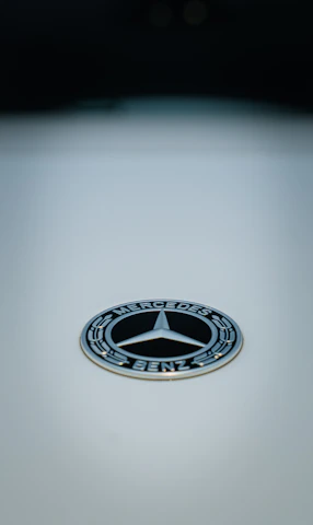 Mercedes collectible card with elegant design and metallic accents.