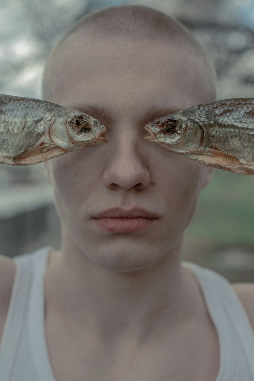 a woman with two fish on her face