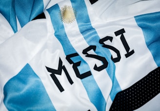 a close up of a soccer jersey with the word messi on it