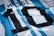 A close-up of a sports jersey with blue and white vertical stripes. The number 10 is prominently displayed in black with small white dots, and the name 'Messi' is just above the number in black font.