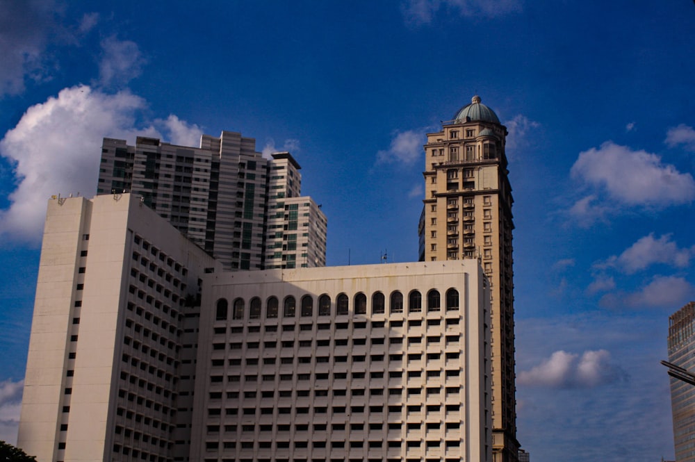 a very tall building with a clock tower in the middle of it