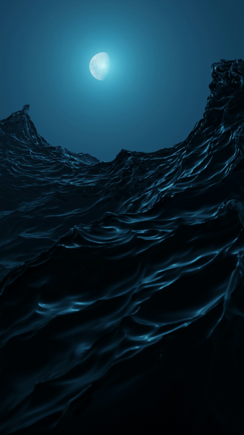 a dark blue ocean with a moon in the sky
