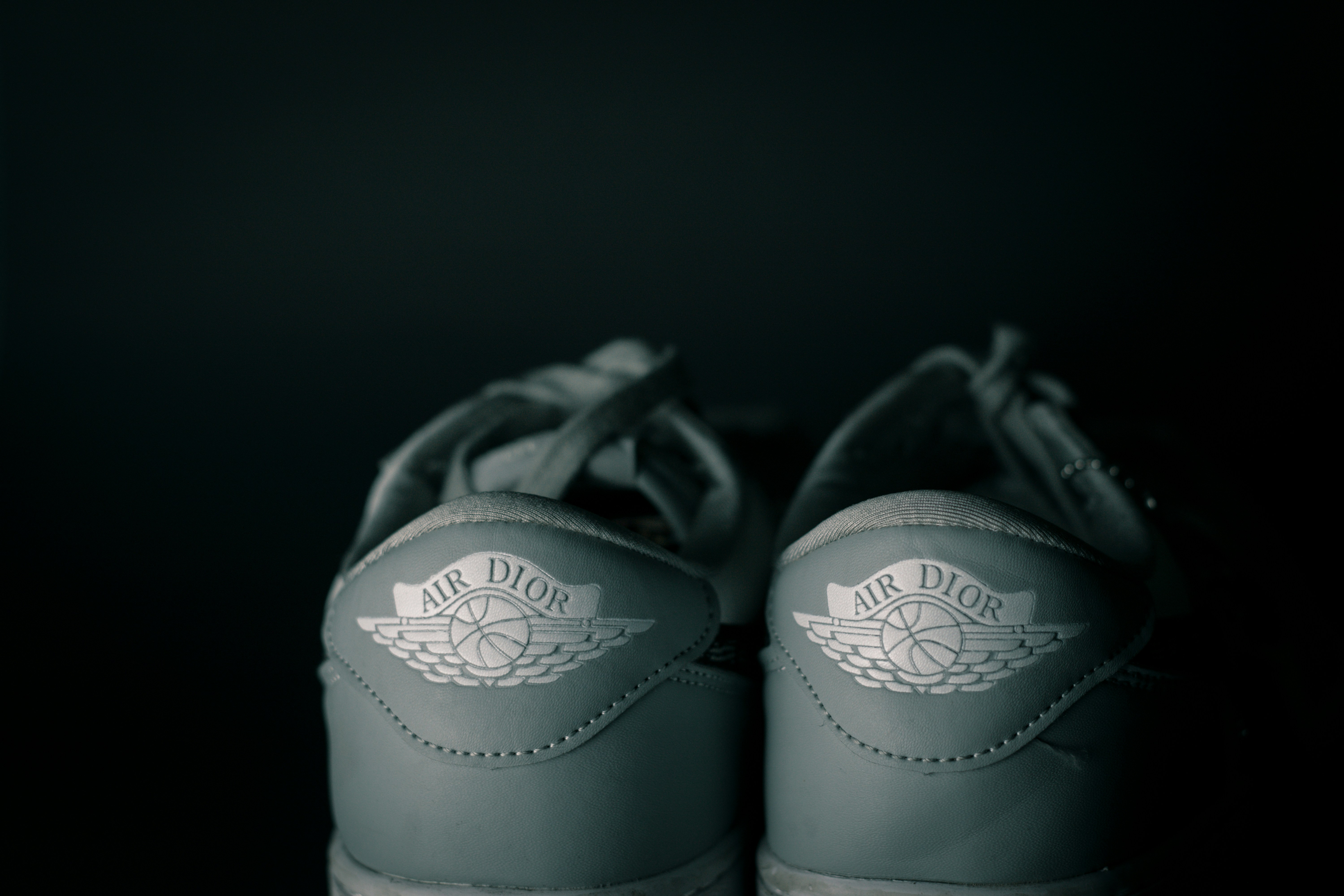 a pair of sneakers with wings on them