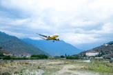 an airplane is flying low to the ground