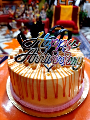 A couple celebrating an anniversary with a cake.