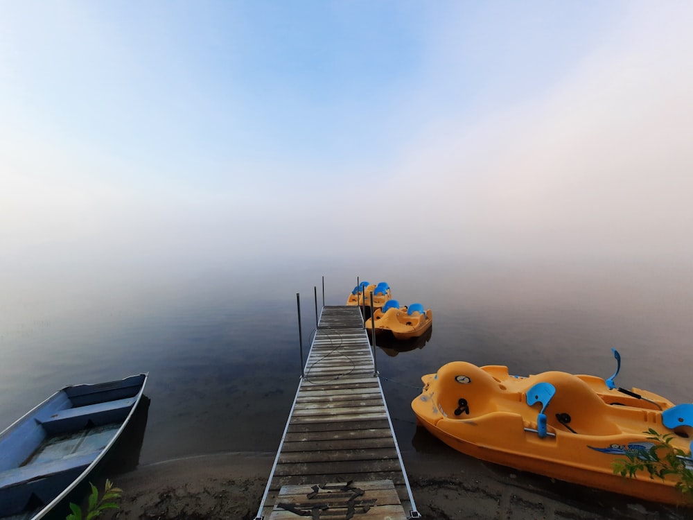 a group of boats sitting on top of a body of water