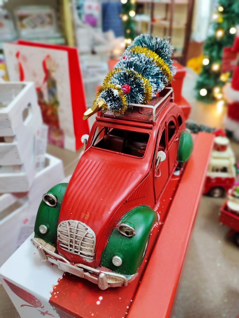 a toy car with a christmas tree on top of it