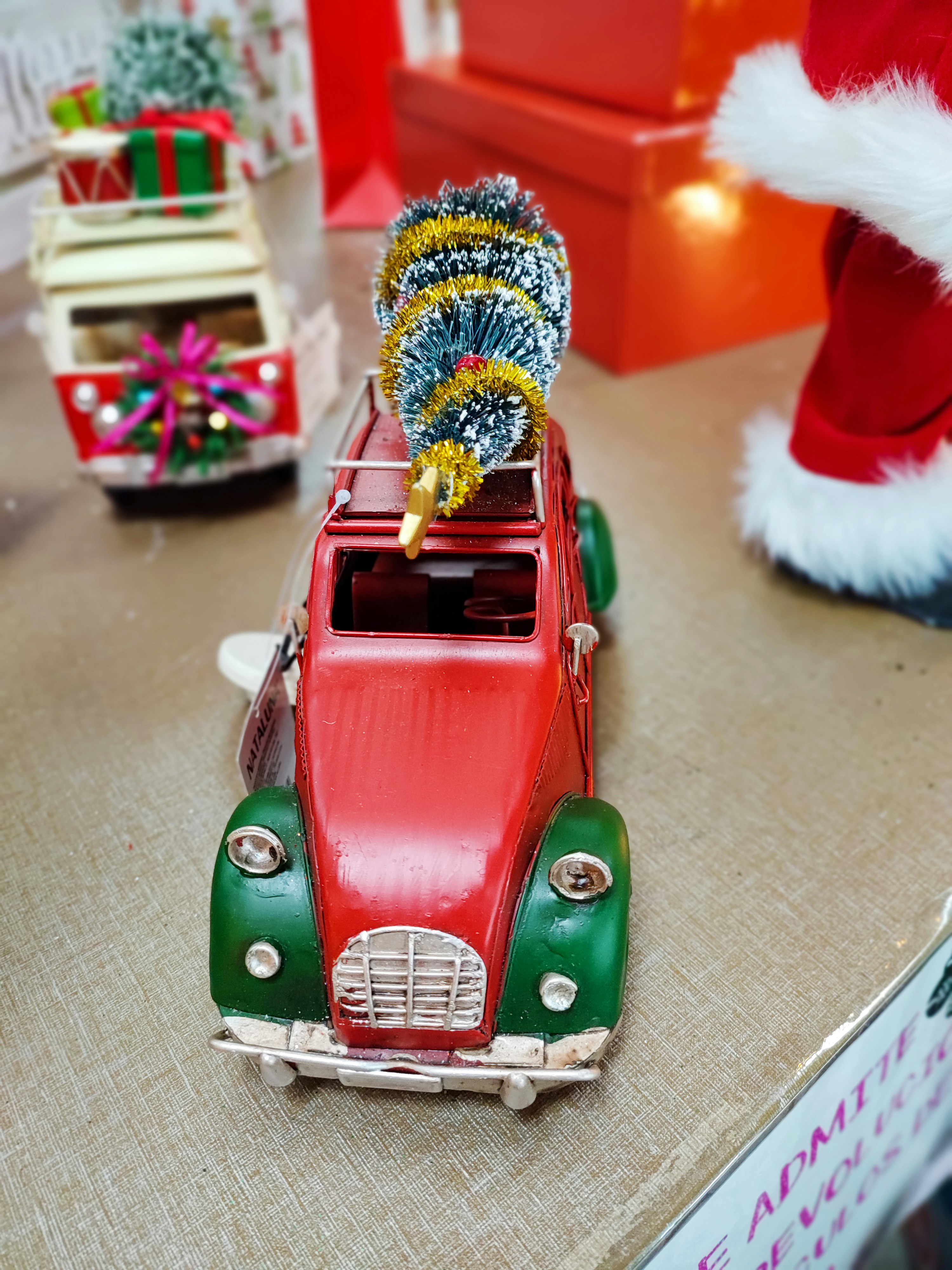a toy car with a christmas tree on top of it