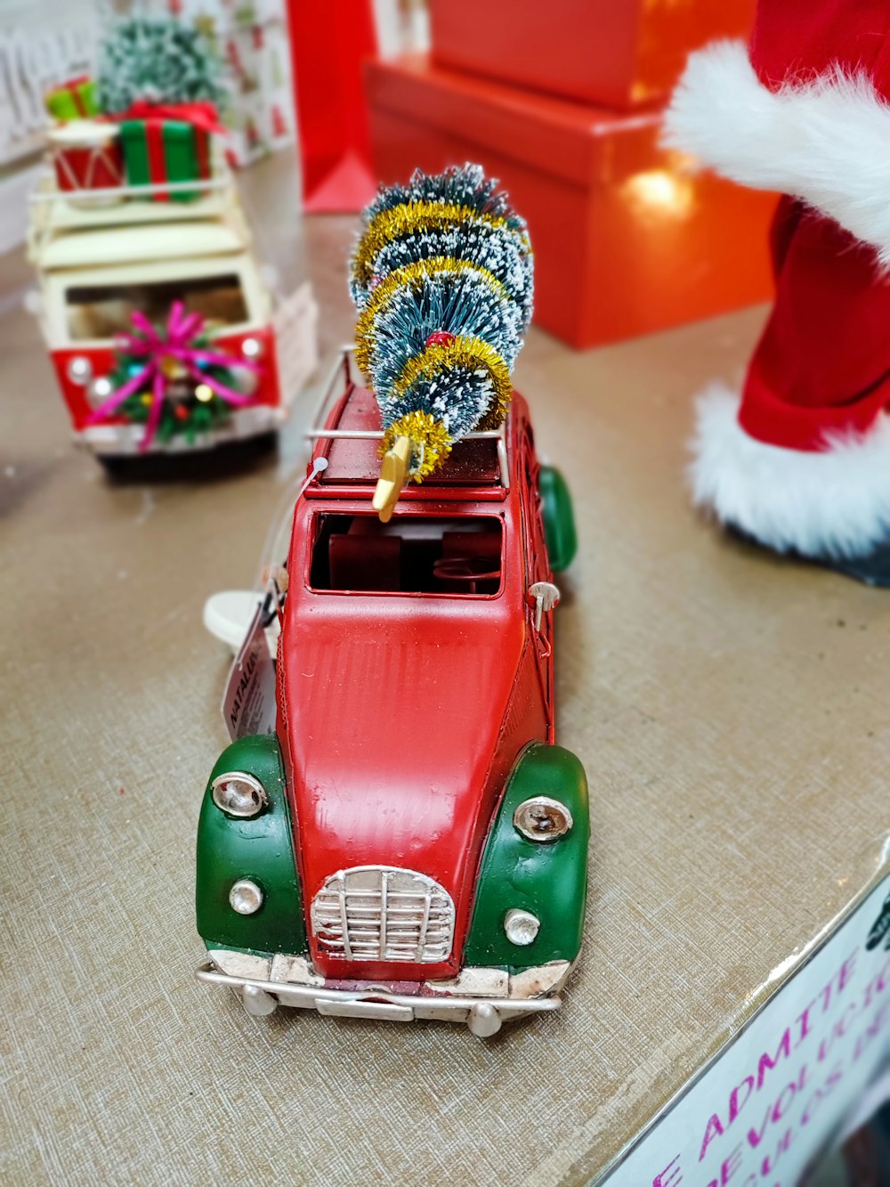 a toy car with a christmas tree on top of it