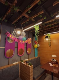 Guests enjoying a lively birthday party inside the SRV Mini Hall with vibrant decorations.