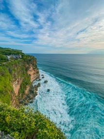 a scenic view of the ocean from a cliff