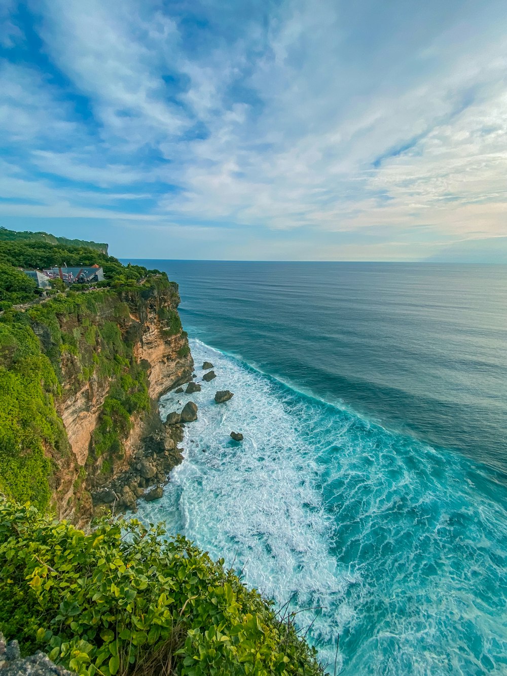 a scenic view of the ocean from a cliff