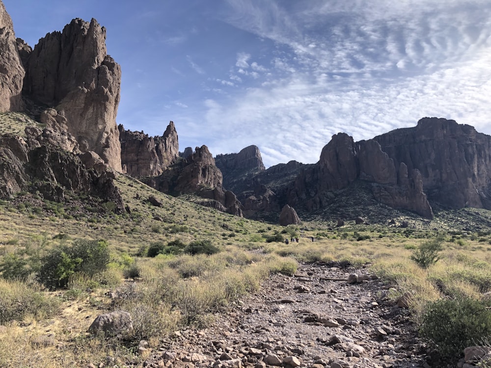 a dirt path in the middle of a mountain range