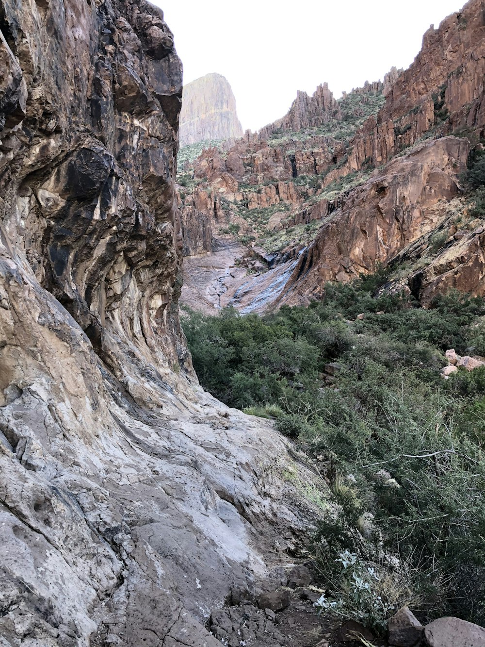 a rocky mountain with a river running through it