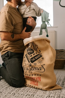 a man holding a baby in his arms