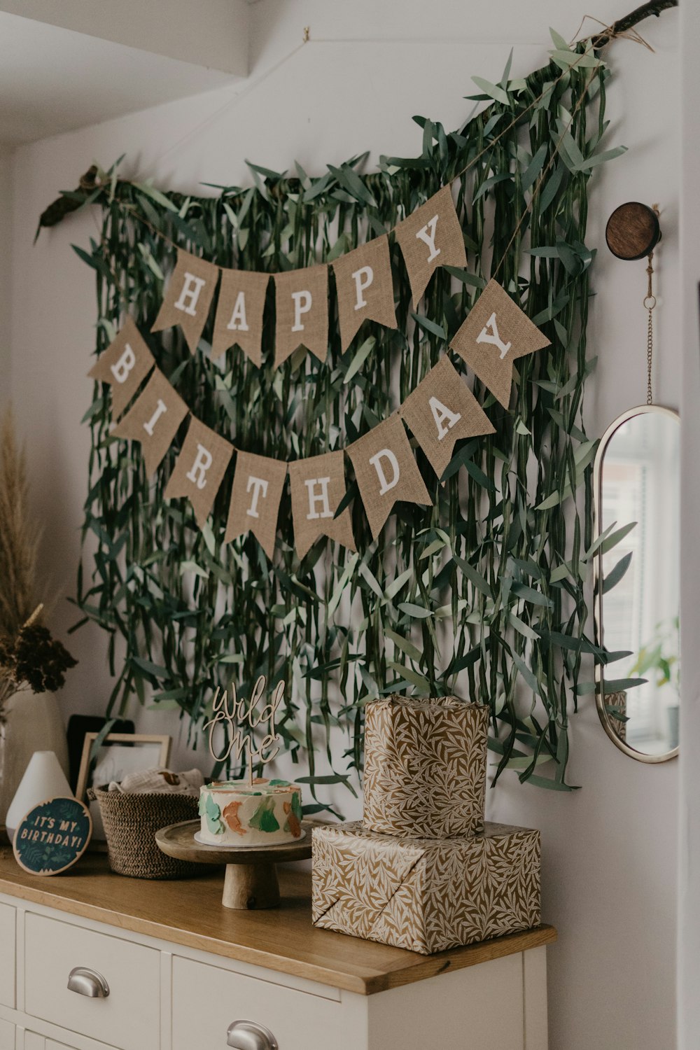 a happy birthday banner hanging on a wall