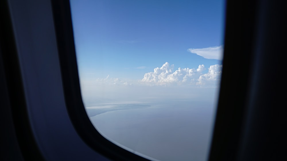 the view out of an airplane window of clouds