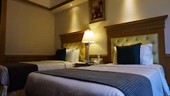 a couple of beds sitting next to each other