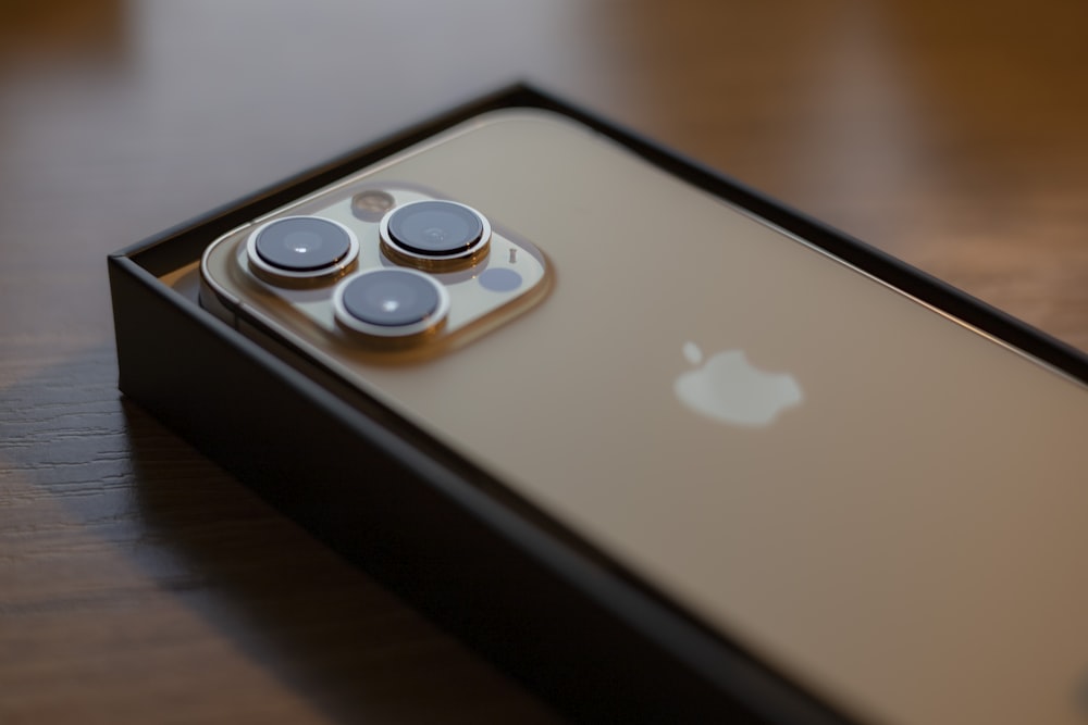 a close up of a cell phone on a table