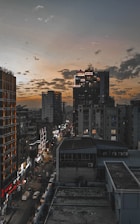 Cloud computing icons floating above a digital cityscape at dusk.