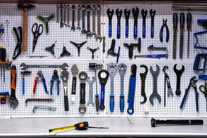 A neatly organised wall of hand tools, ready to go.