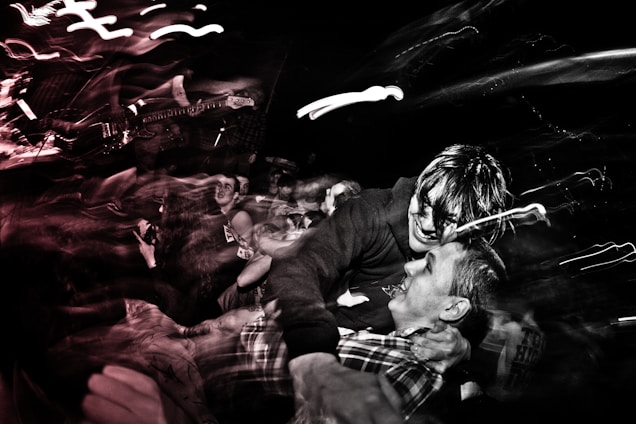 A lively scene showing diverse people happily connecting at a music concert, symbolizing temporary companionship.