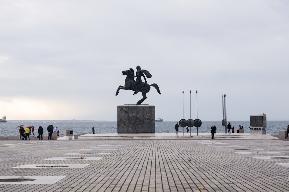 a statue of a man riding a horse in a plaza