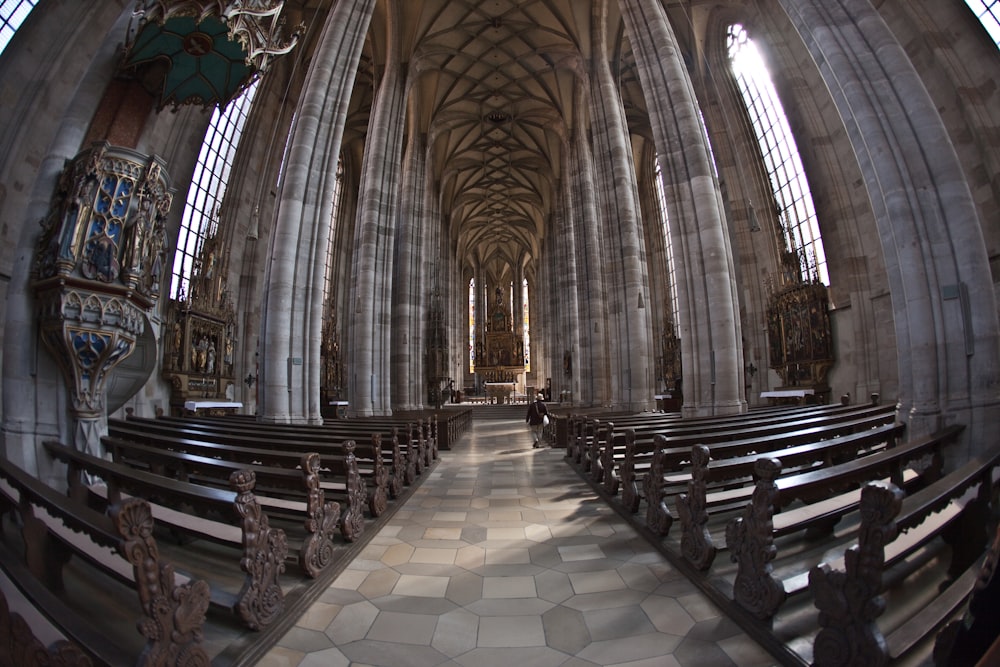 a large cathedral with pews and a chandelier