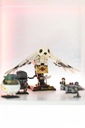 A sleek acrylic display case highlighting a detailed Lego set under soft lighting.
