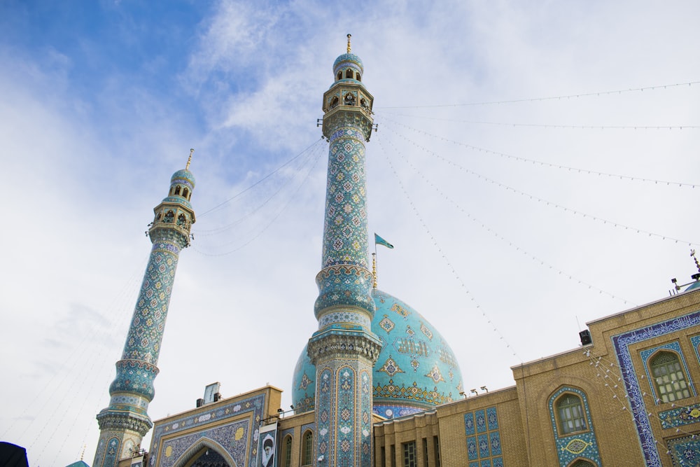 a large blue and white building with two towers