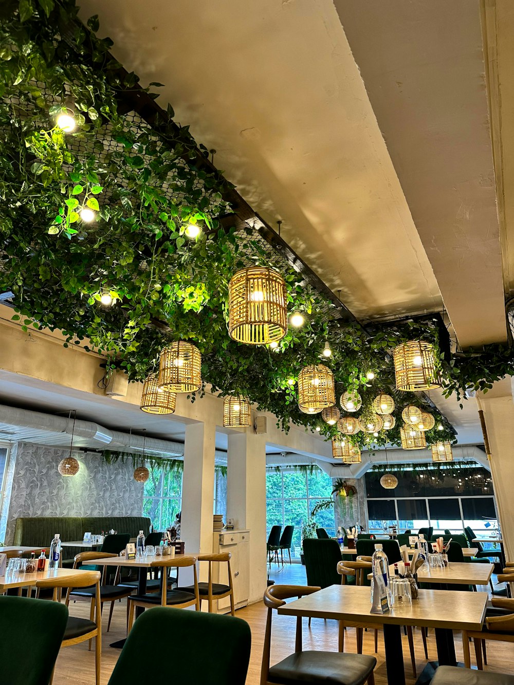 a restaurant filled with lots of tables and chairs