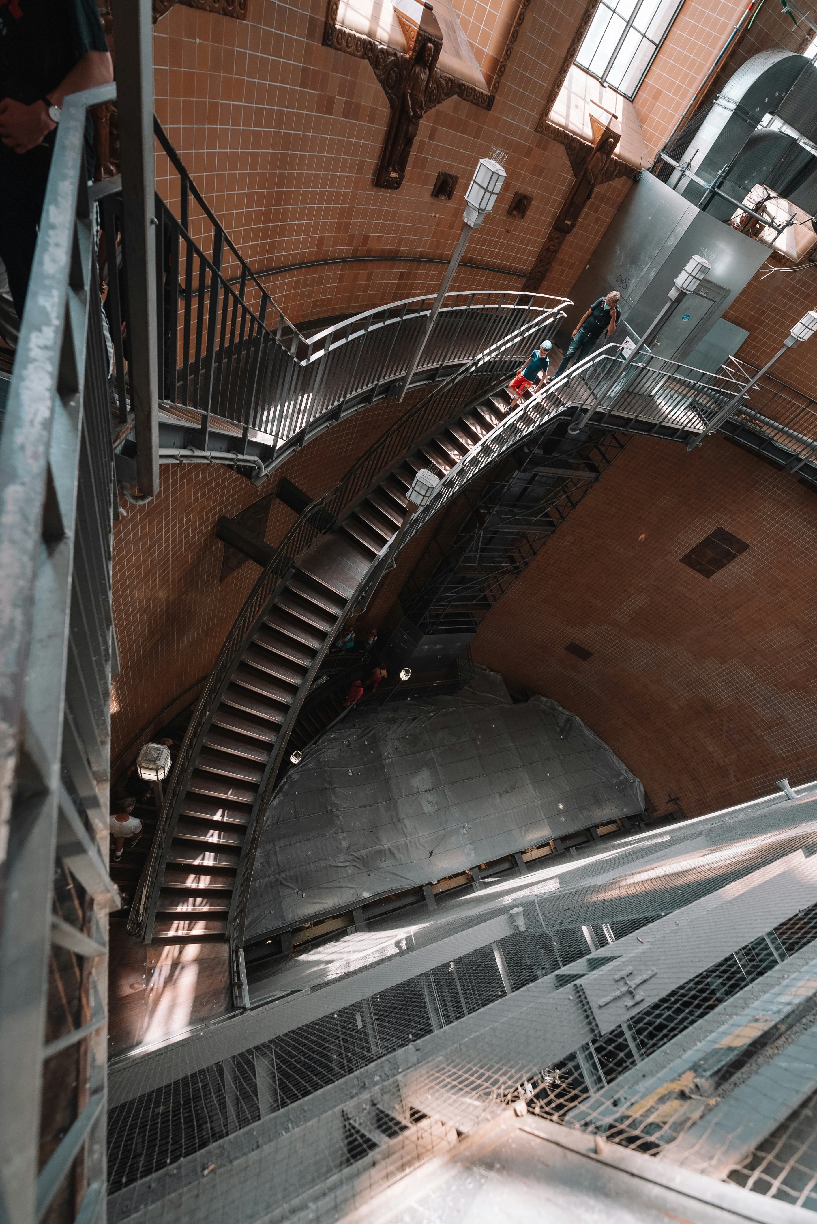 a group of people walking up and down a set of stairs