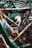 A tightly packed jumble of bicycle frames and parts with visible rust and wear, highlighting a collection of old or possibly abandoned bicycles.