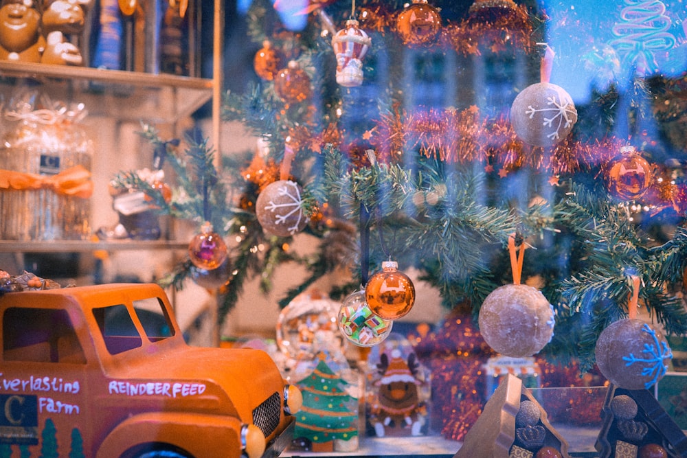 a toy truck is parked in front of a window