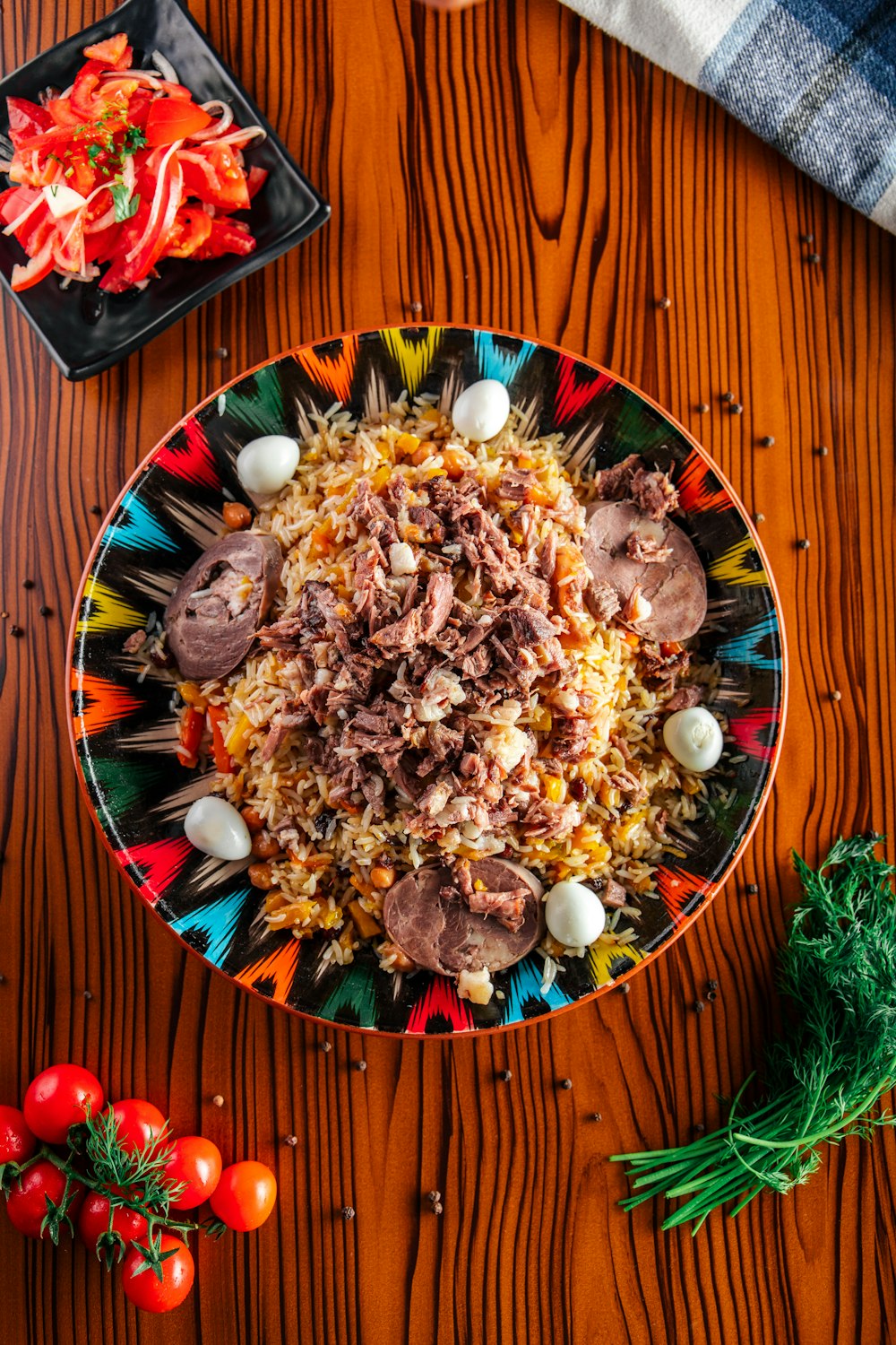 a colorful plate of food on a wooden table